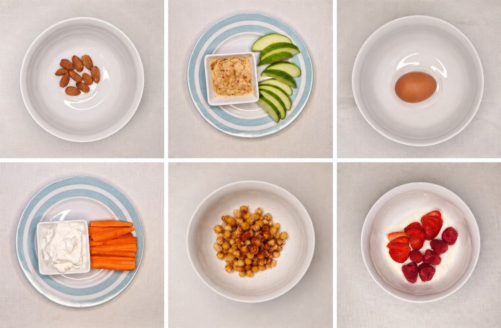 Examples of protein-rich snacks including almonds, apple with peanut butter, a boiled egg, carrot with cottage cheese, roasted chickpeas and Greek yoghurt with berries
